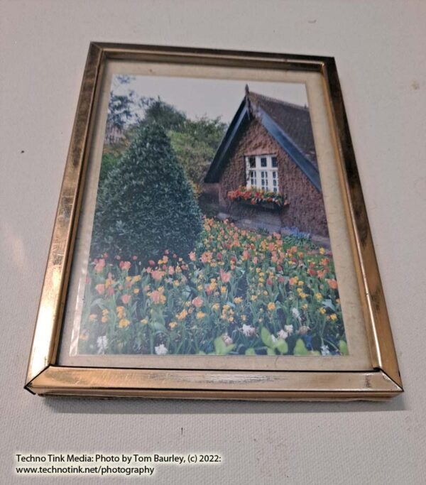 A centrally themed historic cottage with flowers in Dublin Park 6x4 photo in 7x5 gold metal frame